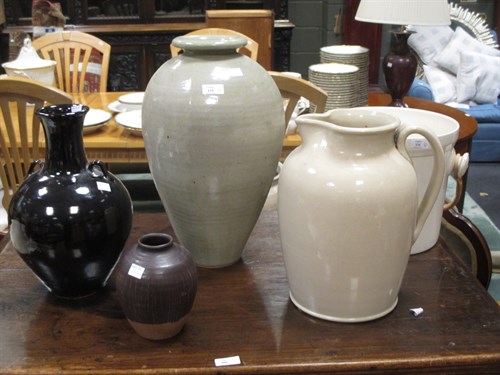 Lot 134 - A Studio pottery treacle glaze vase, the...