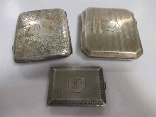 Lot 210 - Two silver pocket cigarette cases and a silver...