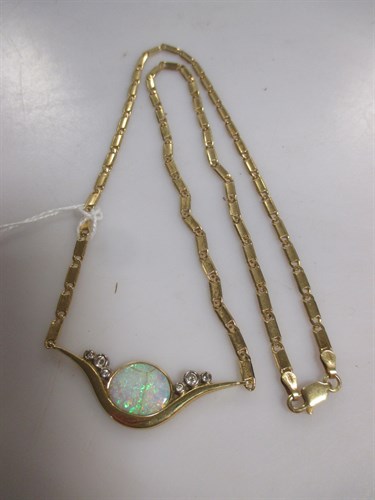 Lot 167 - An 18ct gold opal and diamond set pendant by...