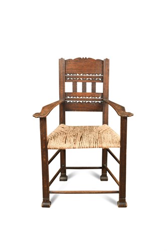 Lot 96 - A Continental oak rush seated armchair