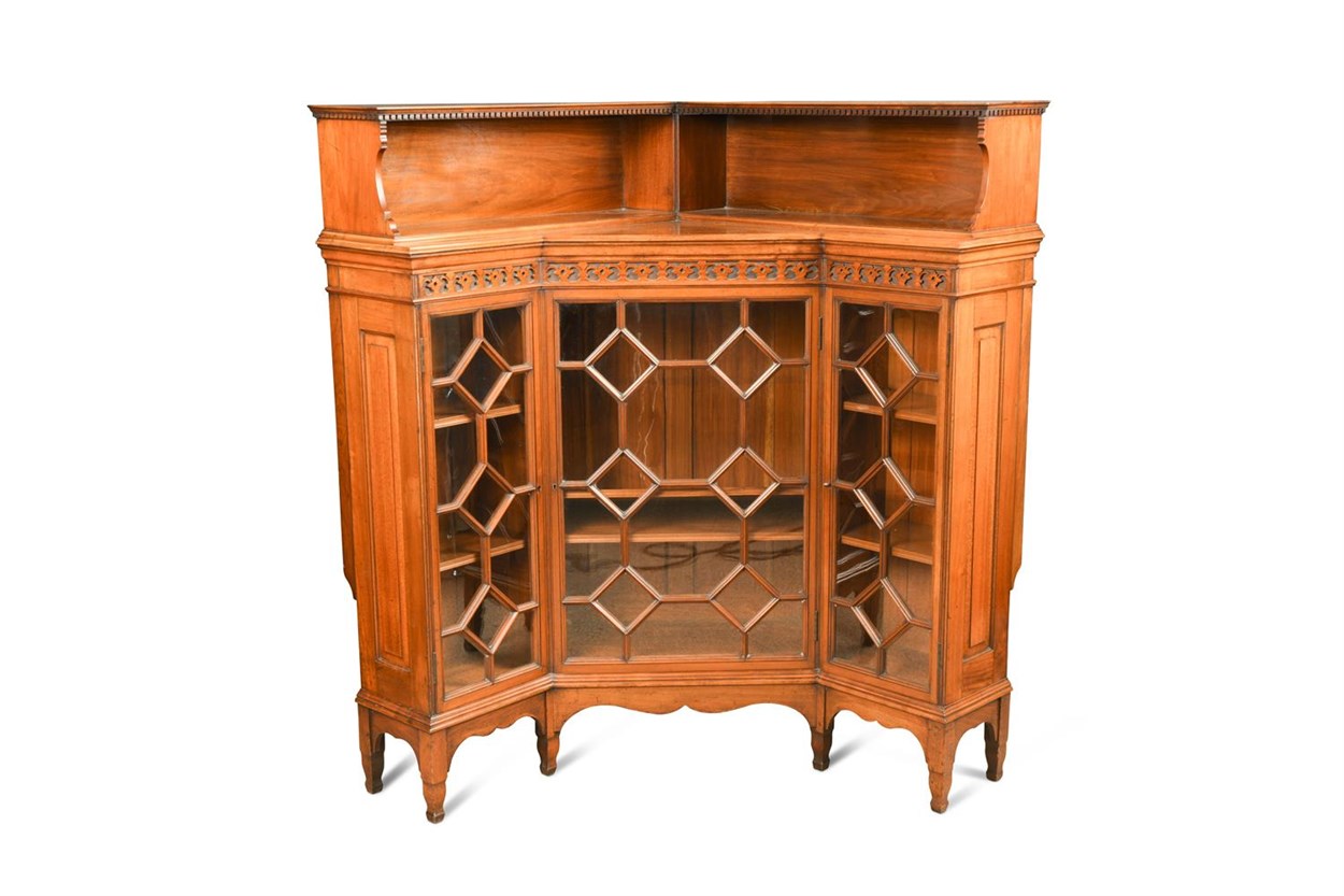 Lot 99 - Attributed to George Washington Jack (British, 1855-1932) for Morris & Co., an Arts & Crafts walnut corner bookcase cabinet