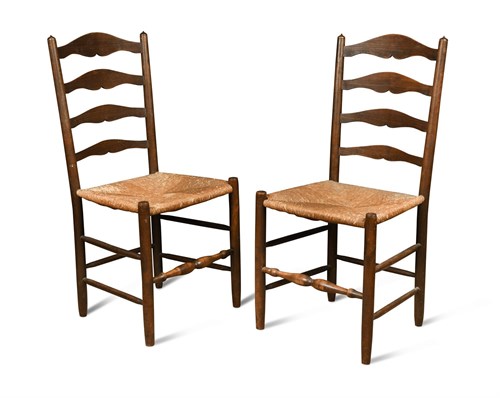 Lot 100 - Edward Gardiner, a pair of stained ash ladder back chairs, circa 1920