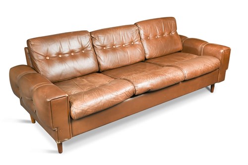 Lot 151 - A 1970's Danish brown leather three-seat sofa