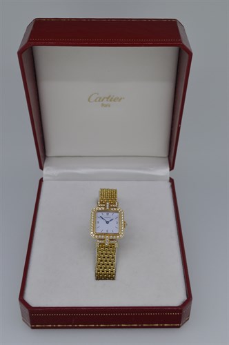 Lot 399 - Cartier - An 18ct gold diamond set lady's wristwatch