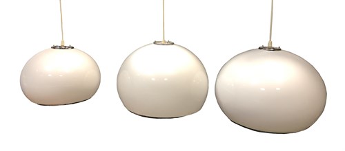 Lot 81 - Attributed to Harvey Guzzini, a graduated set of three white acrylic bulbous pendant lights