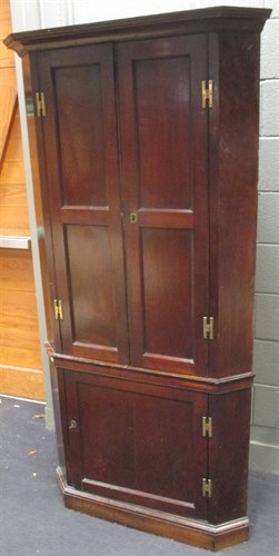 Lot 383 - A 19th century oak standing corner cupboard...