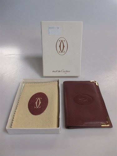 Lot 164 - Cartier - A burgundy leather credit card...