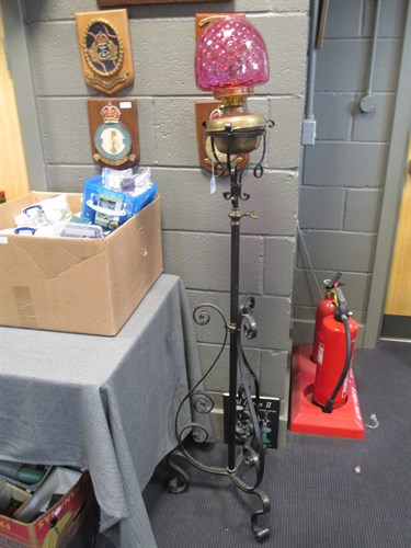 Lot 335 - A wrought iron and brass telescopic floor...