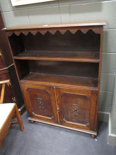 Lot 384 - An Edwardian free standing bookcase with two...
