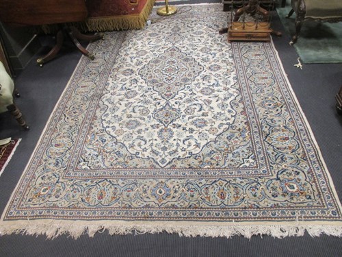 Lot 458 - A cream gound rug, with blue border, 312 x 198cm