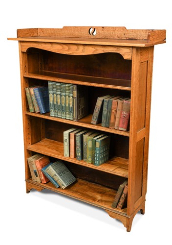 Lot 102 - An Arts and Crafts oak bookcase in the manner of Liberty's