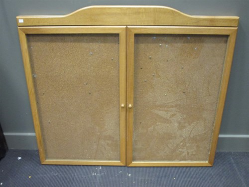 Lot 375 - An oak glazed fronted notice board, 105 x 120cm