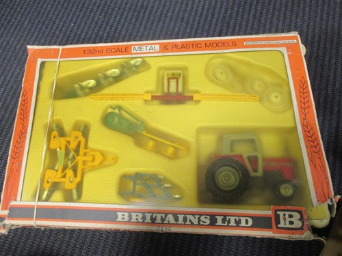 Lot 17 - Britains; A 9592 Farm Tractor and implement...