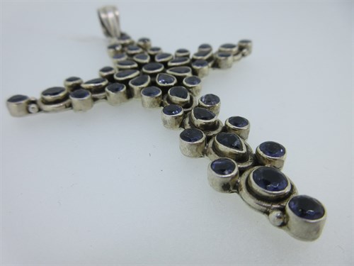 Lot 440 - A large cross pendant set with iolites