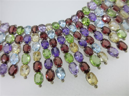 Lot 213 - A "tutti frutti" gem set bib style fringe necklace