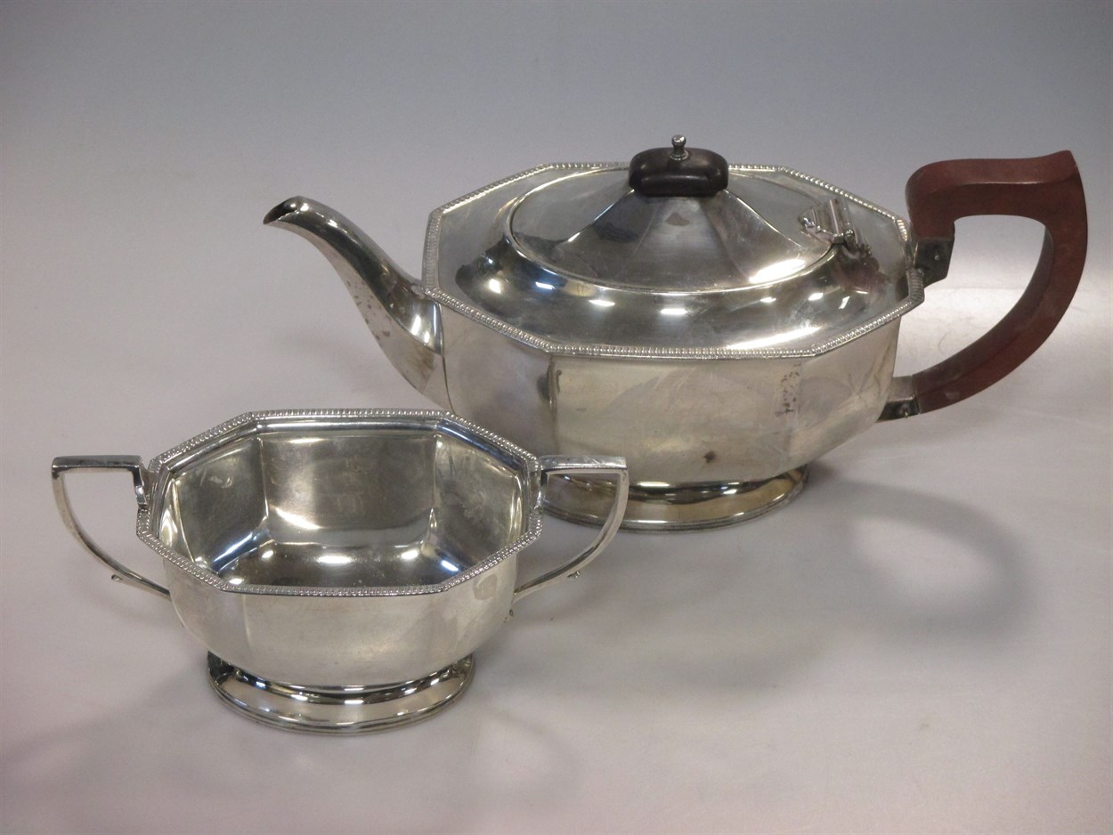 Lot 229 - An Edwardian silver tea pot and twin handled