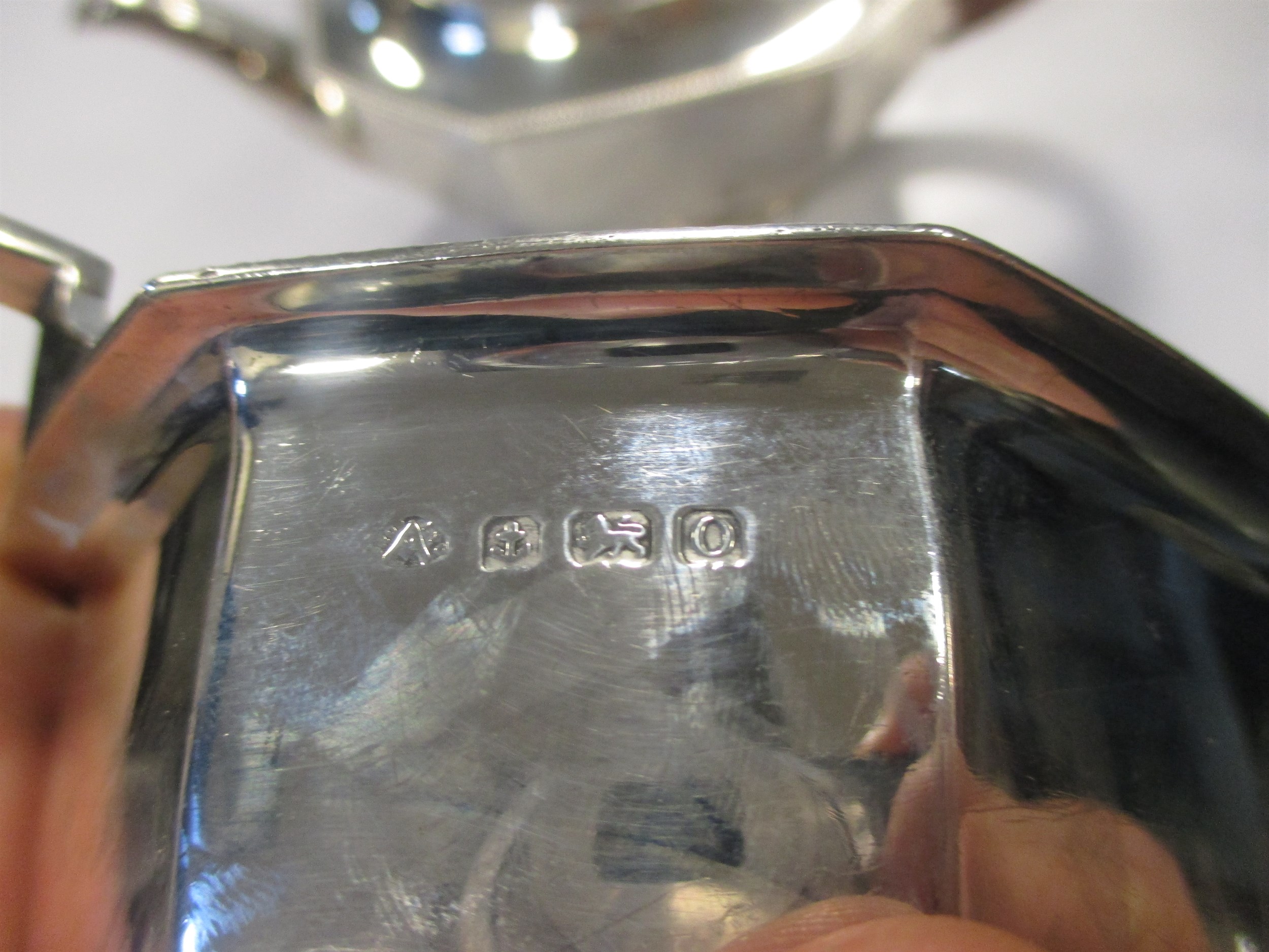 Lot 229 - An Edwardian silver tea pot and twin handled