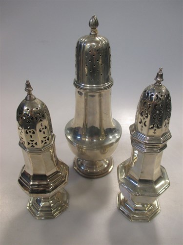 Lot 218 - Three Edwardian silver sugar casters, 13oz