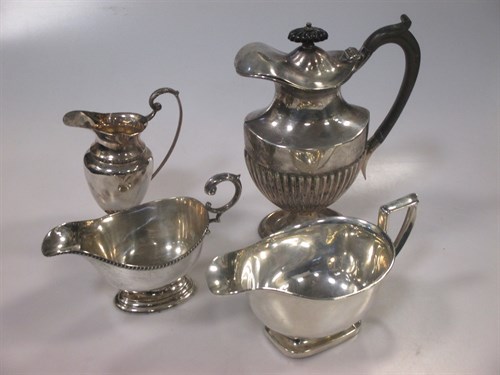 Lot 224 - A silver hot water jug, two sauce boats and a...