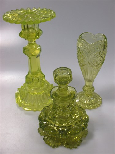 Lot 143 - Uranium glass, to include two candlesticks, a...