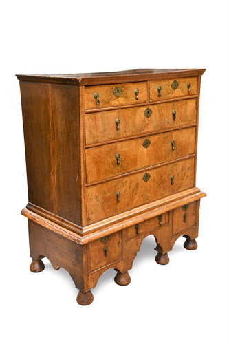 Lot 322 - An early 18th century oak and walnut chest on stand