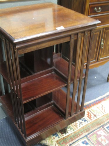 Lot 385 - An Edwardian walnut revolving bookcase, 85 x...