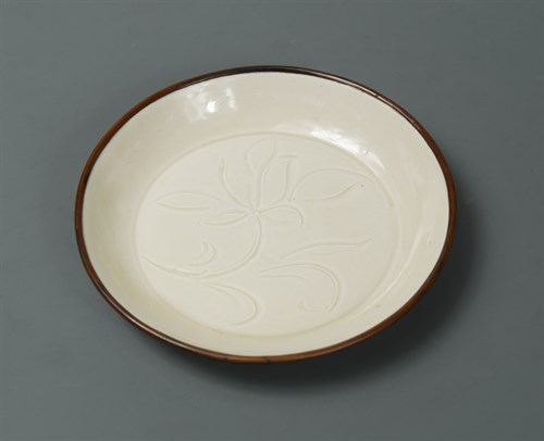 Lot 35 - A Song dynasty small carved Ding ware dish