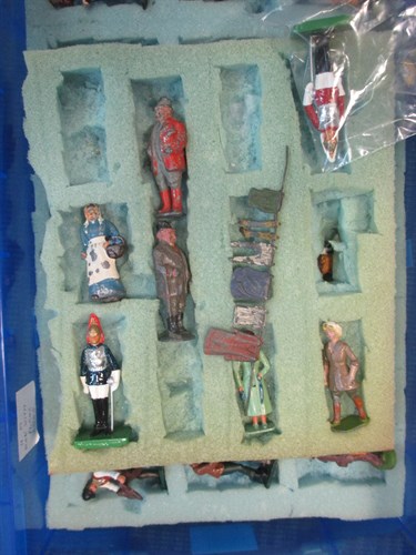 Lot 73 - A quantity of lead figures of men and women...