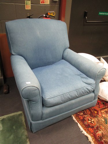 Lot 398 - A large blue denim upholstered armchair