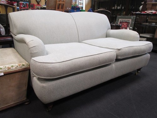 Lot 348 - A modern upholstered two seater sofa, on...