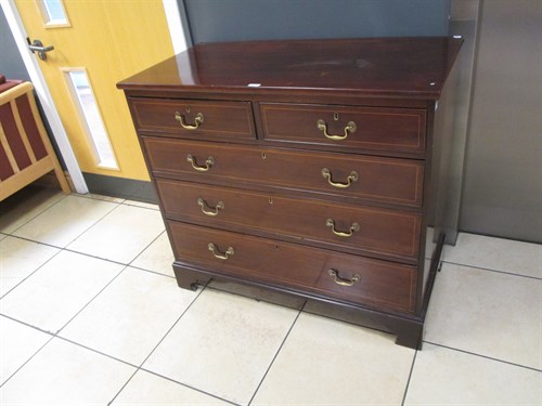Lot 424 - A mahogany chest of drawers on bracket feet,...
