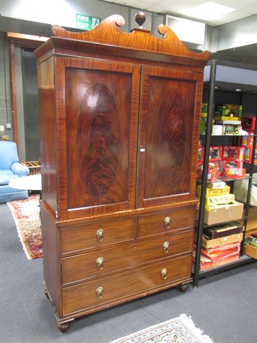 Lot 416 - A Regency mahogany linen press with fret...
