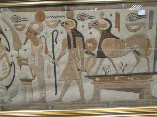 Lot 252 - A pair of Egyptian embroidered panels, framed,...