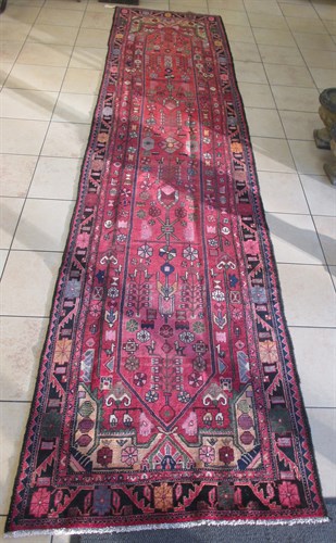 Lot 393 - An Azerbaijan carpet 5.20 x 1.20 m