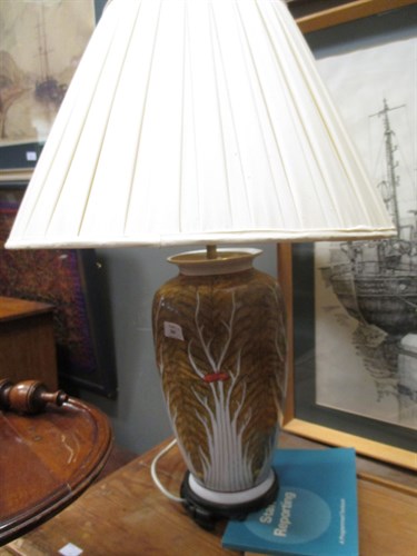 Lot 380 - A pair of Oriental table lamps on wooden...