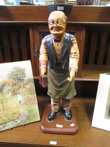 Lot 159 - A painted standing inn keeper type figure and...