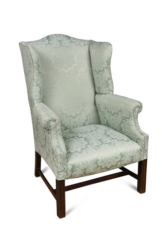 Lot 341 - A George III style wing back armchair