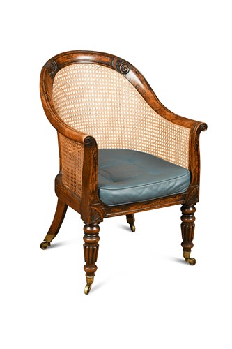 Lot 352 - A Regency faux rosewood bergere library chair
