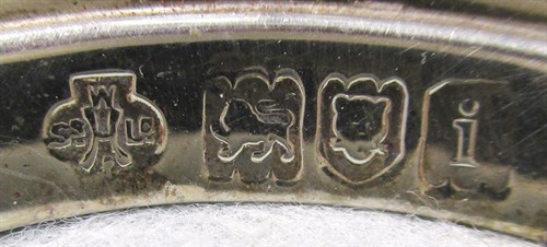 Lot 99 - A set of four Edward VII silver candlesticks