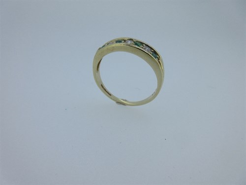 Lot 352 - A 9ct gold emerald and diamond half eternity style ring