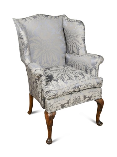 Lot 329 - A small George III style wing back armchair