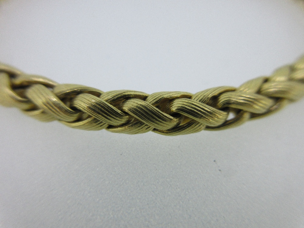 Lot 259 - An 18ct gold bracelet