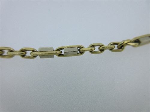 Lot 255 - An 18ct gold fancy link chain together with a pair of 18ct gold peridot set earstuds