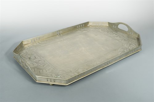 Lot 92 - Attributed to Margaret Gilmour (1860-1942), a Glasgow School silvered brass twin-handled tray