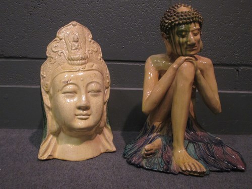 Lot 59 - A pottery figure of Buddha and a ceramic head...