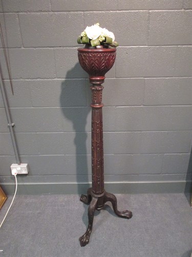 Lot 249 - A Victorian acanthus carved torchere on claw...
