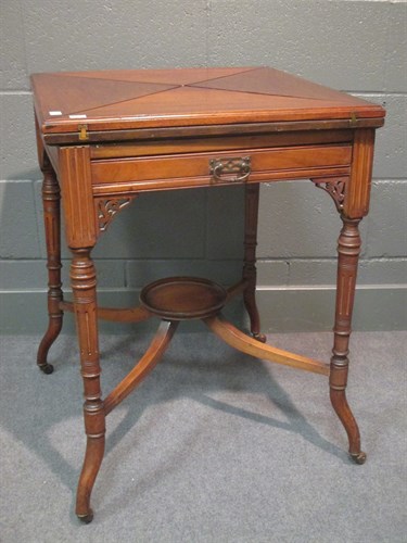 Lot 287 - An Edwardian walnut envelope card table