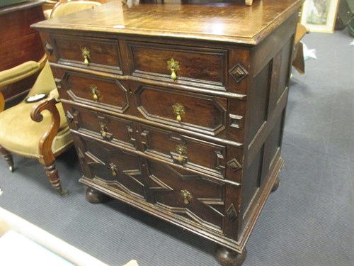 Lot 332 - A 17th century oak chest with geometric drawer...