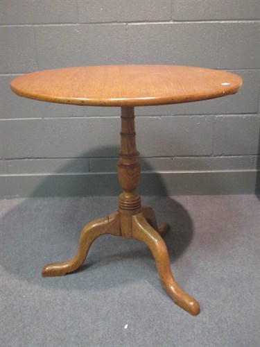 Lot 321 - A 19th century oak tilt top tripod table, 75 x...
