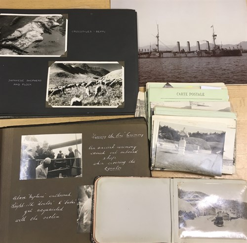 Lot 255 - Photographs. A small album of scenes of World...